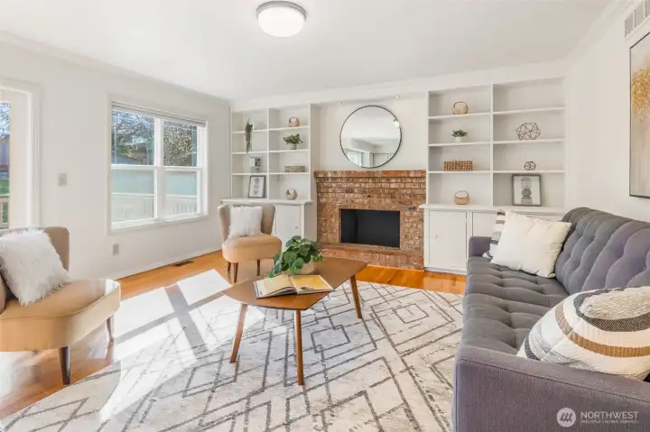 Spacious family room ideal for relaxing or gathering, cozy up to the gas-ready fireplace.