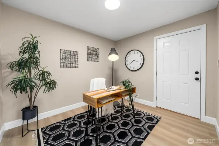 3rd bedroom set up as an office with entry to back yard.