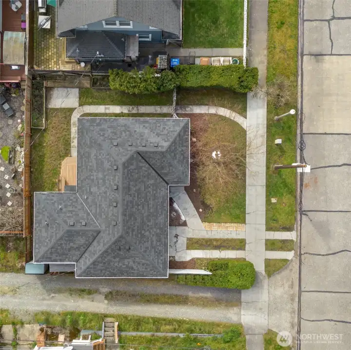 Situated on a corner lot with alley access, the property includes driveway parking for one car, plus additional street parking.