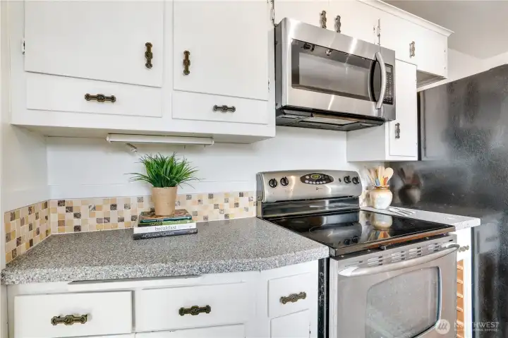 Ample cabinets and drawers provide practical storage for everyday kitchen essentials.