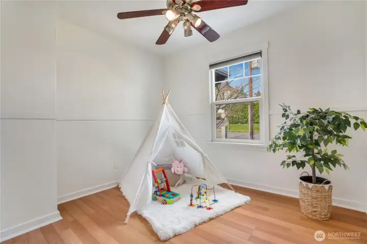 A second bright and cozy bedroom offers a comfortable, inviting space.