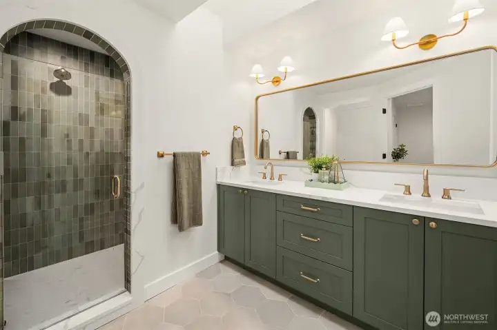 Gorgeous arched shower with rich tile work