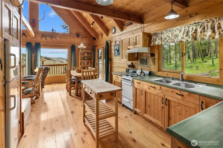 All the comforts of home without the noise. Canadian spruce log walls, Arkansas yellow pine flooring, tongue-&-groove knotty pine ceilings.