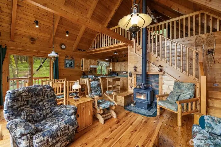 Fully furnished and turn key. Wood stove for ample heat & spacious upper loft sleeping quarters
