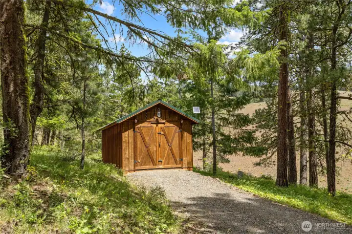 Large detached garage for equipment, toys, or parking.