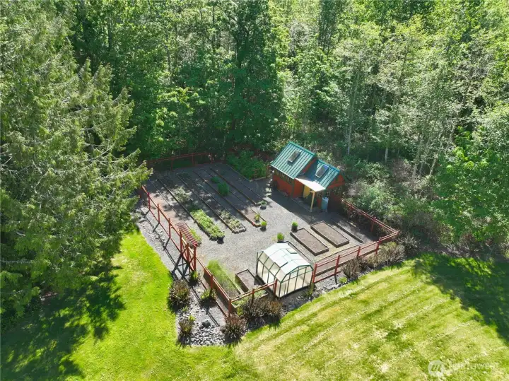 An aerial view of the raised bed garden and garden house.