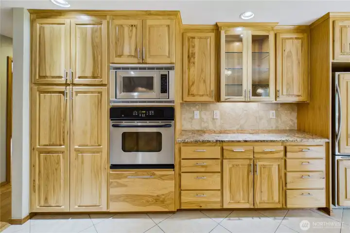 Storage was always in mind with this home- extensive custom cabinetry and a very usable, efficient kitchen and bar area.