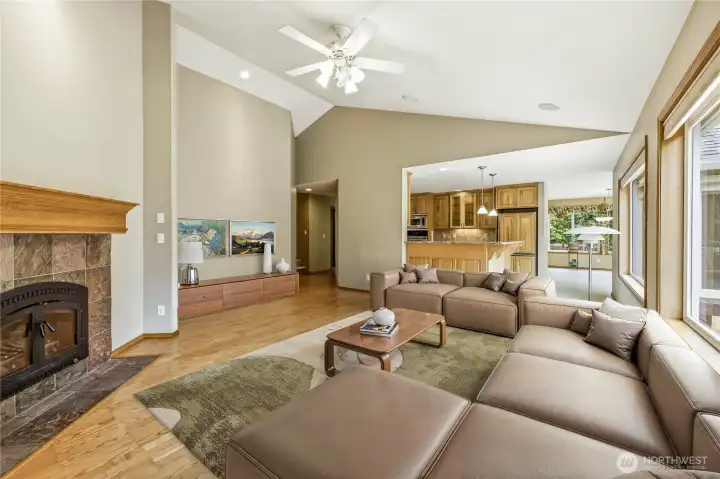 Virtually staged, the living room sits just off the kitchen, ideal for sitting by the fire after dinner.