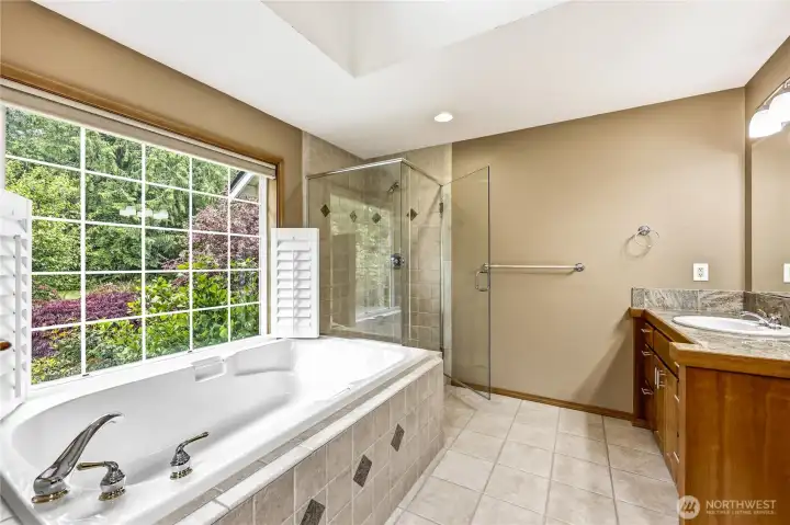 Primary bedrooms bathroom with soaking tub and shower. No space was left unconsidered.