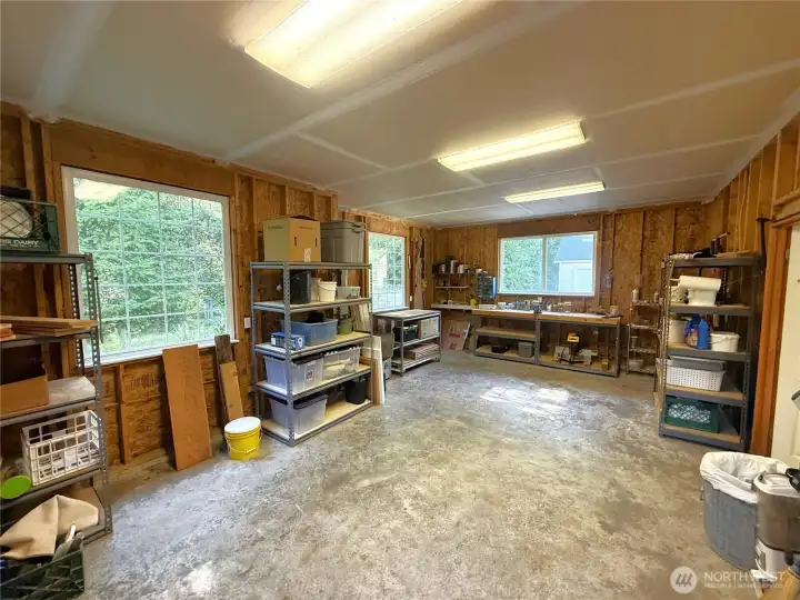 Beside the two car attached garage, is a separate, attached workshop with radiant heat, power and good lighting.