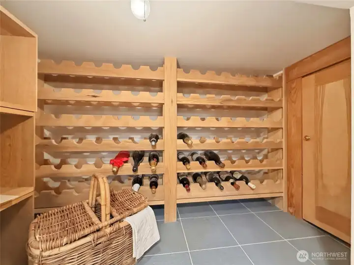 Natural, tempered wine cellar with Maple wood and reclaimed Tile from the original Space Needle floor!