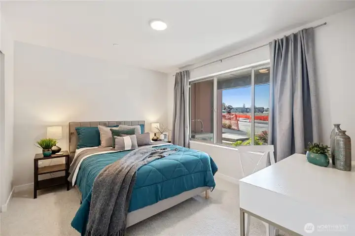 Spacious primary suite filled with natural light with walk in closet Spacious primary suite filled with natural light with walk in closet