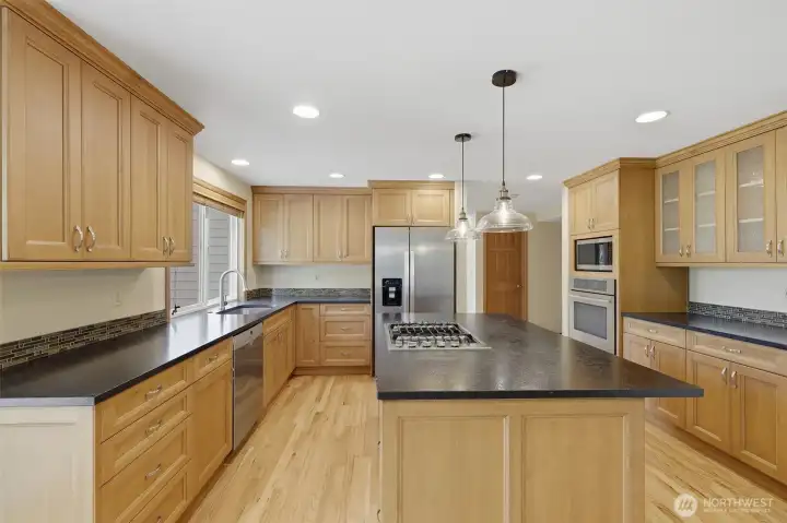 Fully remodeled kitchen has so much to offer! Updated cabinets, slab granite counters, huge island perfect from entertaining, and high end stainless steel appliances.