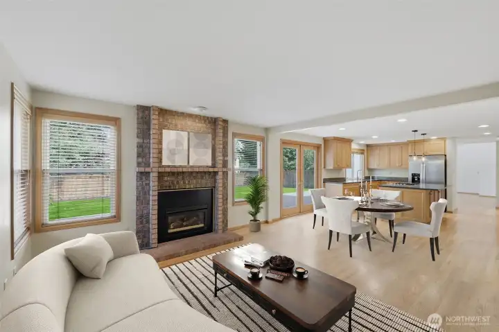 View of den and dining nook. Gas fireplace to help with ambiance and comfort. Virtually staged
