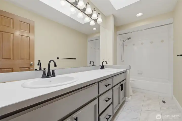 Upstairs full bath has been tastefully remodeled.