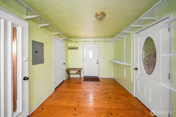 Extra wide and spacious entry area. To the right is the garage dome with a bathroom with showers and lots of storage - workout room, art studio, office, etc. Extra wide and spacious entry area. To the right is the garage dome with a bathroom with showers and lots of storage - workout room, art studio, office, etc.