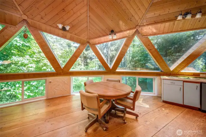 Stunning dining room space with doug fir wood floors harvested from the property. Stunning dining room space with doug fir wood floors harvested from the property.