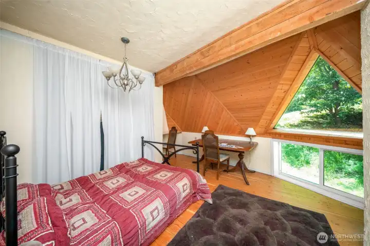 Bedroom off of the living area. Such a cool space with the triangle window and plastered walls. Bedroom off of the living area. Such a cool space with the triangle window and plastered walls.