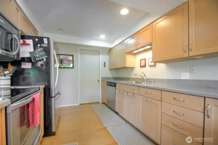 beautiful kitchen with abundance of cabinets and counters