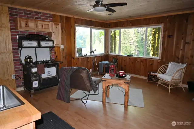 The cottage boasts NEW roof, windows, permitted 4C panel, Generac generator w/automatic transfer switch, fan on remote and more.