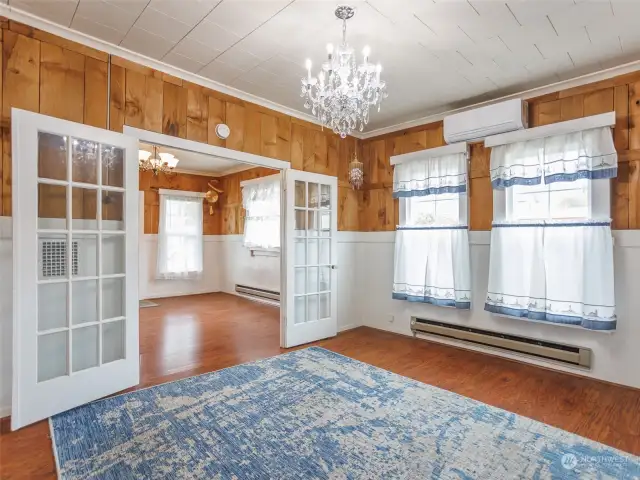Enter the dining room via French doors, and feel comfortable with the updated ductless A/C.
