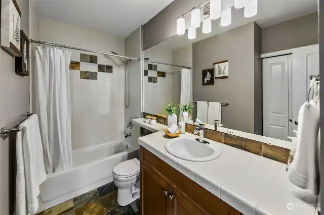 Everything you need in a bathroom: good lighting, nice counter space and storage.