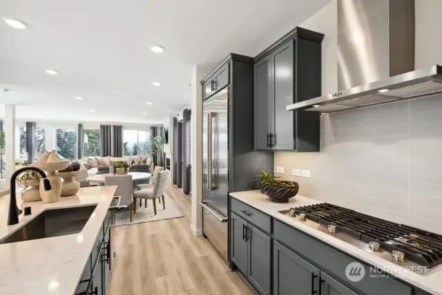 Kitchen features Graphite Maple cabinetry with Matte Black fixtures and includes Jenn Air Stainless Appliances