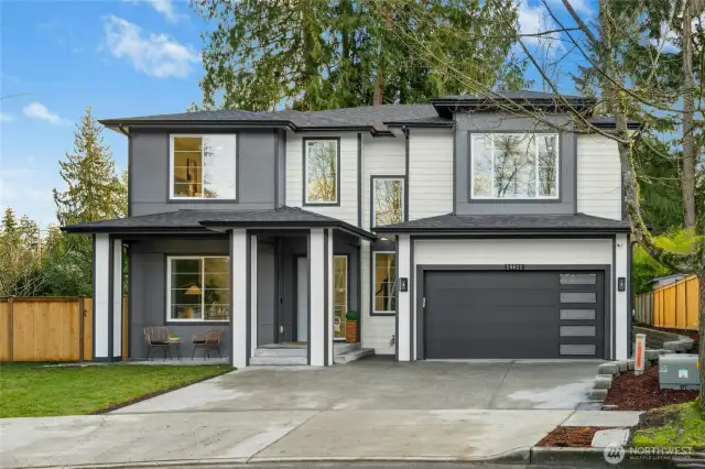 Front of Home. Notice custom garage door and extra large windows