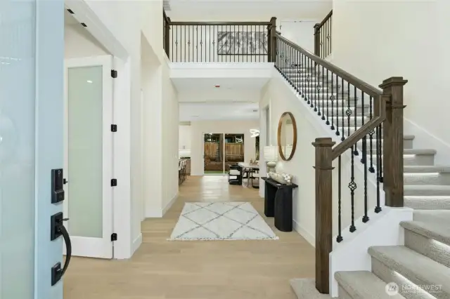 Entry Foyer with full stair railing and understair path lights