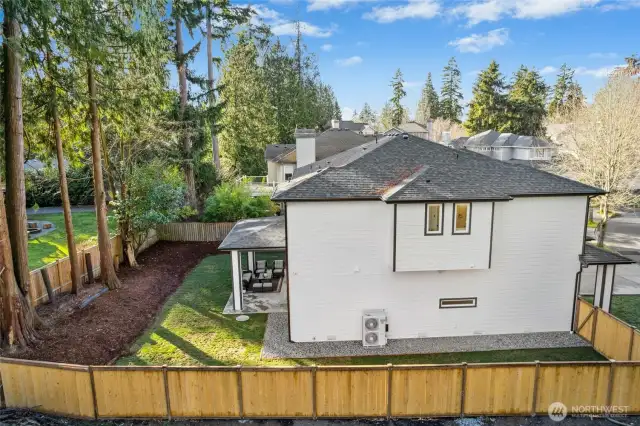 View from drone showings big side yard and backyard