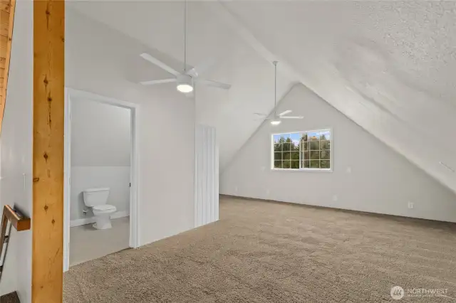 The upstairs loft has a powder room and closet