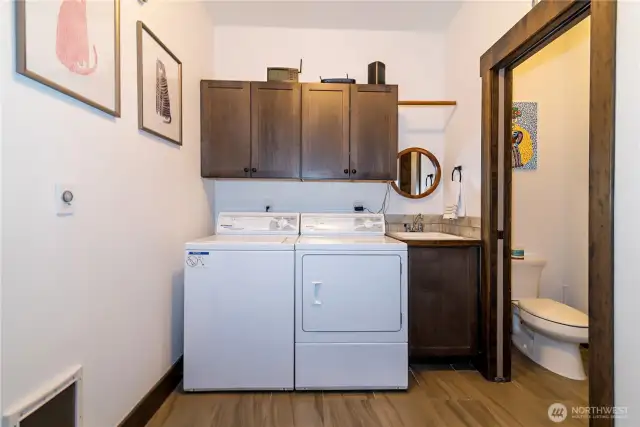 Nice size laundry room and 1/4 bath off of the 3 car garage.