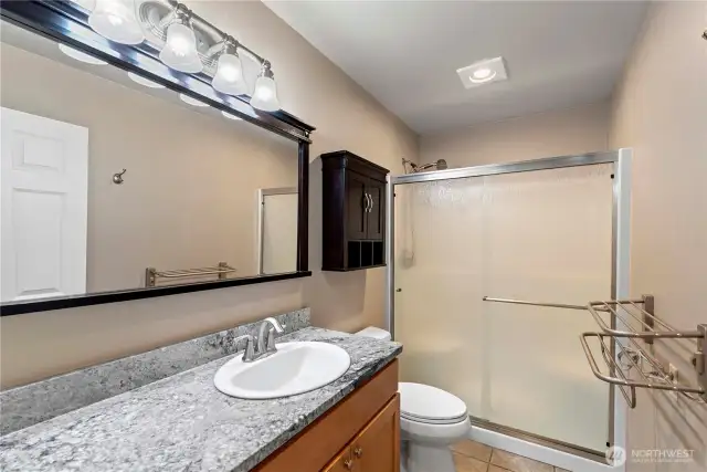 Upstairs bath with extra large shower.