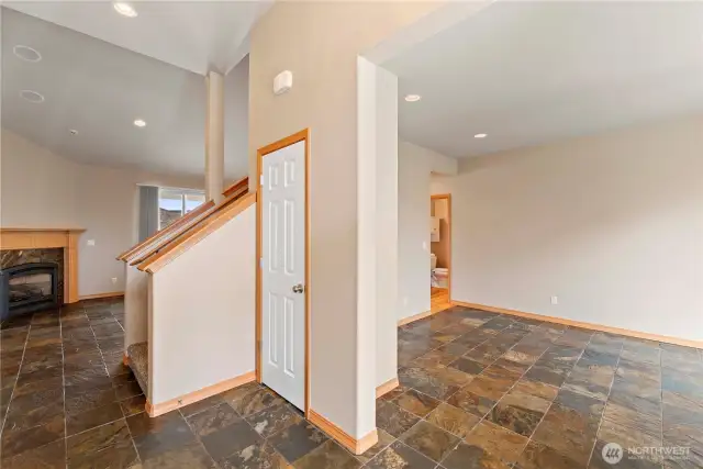 As you enter, to the right is the living room, and ahead is the family room.