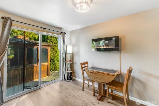 Dining area. Electric fireplace can stay.