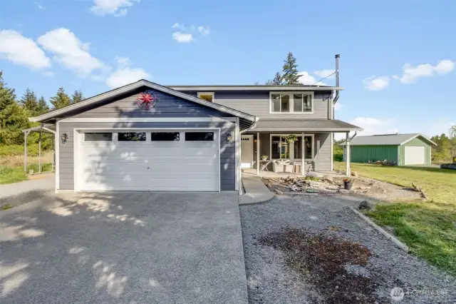 Shop shown at right included and has it's own driveway.