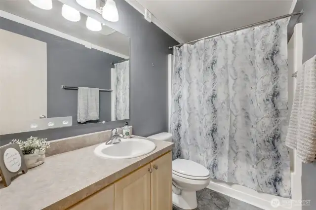 Upstairs hall bathroom with tub/shower.