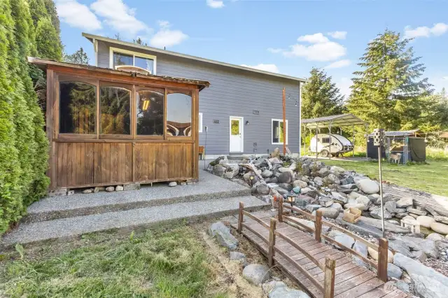 Such a fun backyard. Includes a covered area to put a grill etc.