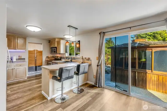 Slider to backyard showing covered area to use as your heart desires or move to open up your view.
