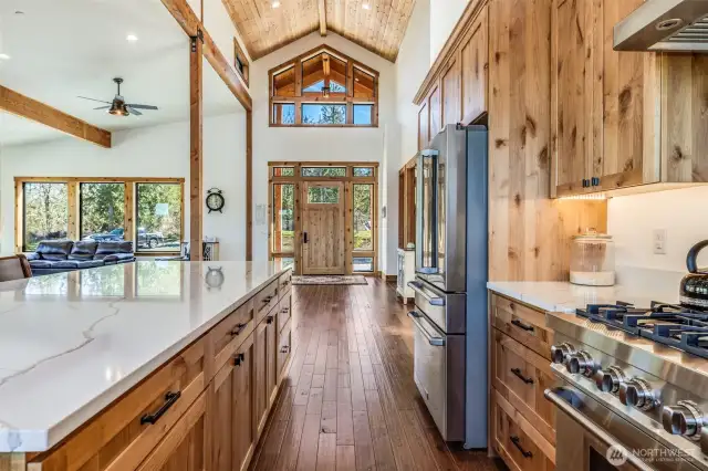 The vaulted cathedral ceilings extend the entire length of home