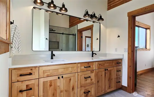 Primary en Suite Bathroom has dual vanity sinks, quartz counters, extra long sinks