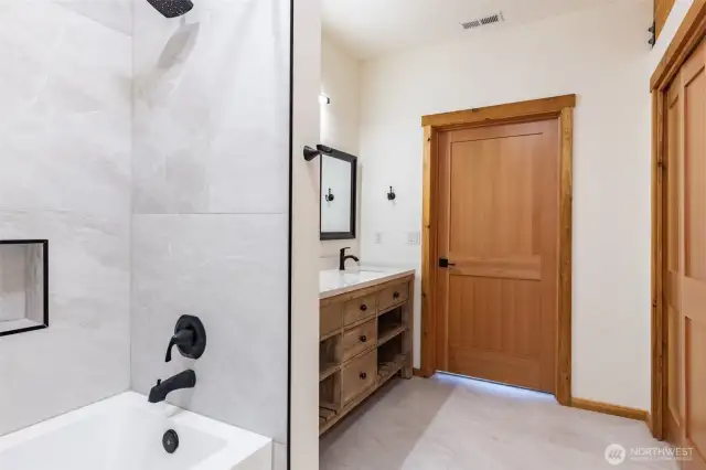 Dual Vanity Full Bath is spacious. Custom cabinets and lots of storage.
