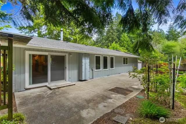 This large patio at the back of the house is the perfect blank slate, ready for your patio set, BBQ and more! It stretches almost the length of the home!