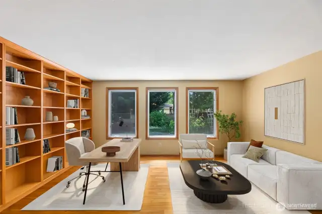 This from room, with custom built in shelving, lends itself to many uses. Virtually staged here to show its versatility.