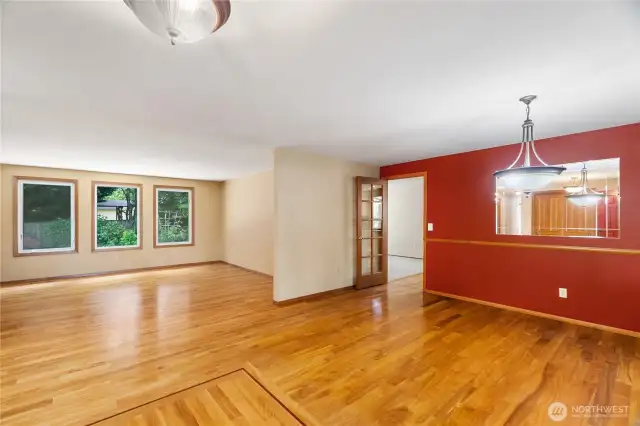 Nice flow between the living room/library and dining room. Nice wood inlay detail defines the entryway.