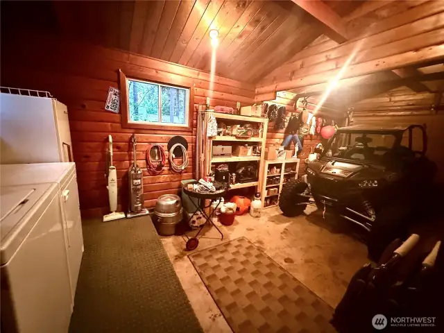 One car garage and utility room in 2nd Pan Abode cabin.