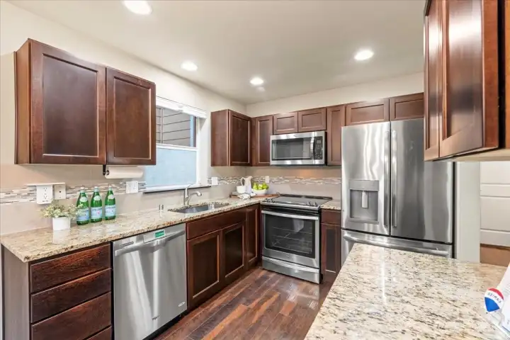 Stainless steel appliances and granite counters.