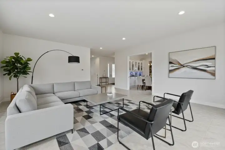 The virtually staged living room opens up to the dinning room