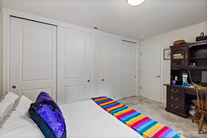 This bedroom has two huge closets and heated floors