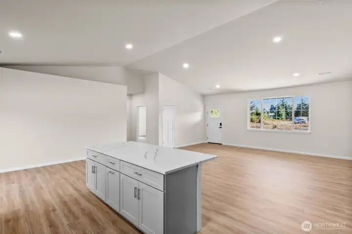 Kitchen island with soft close drawers, under cabinet lighting, and outlets underneath!